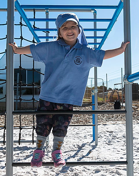 Child playing on Funky Monkey Bars